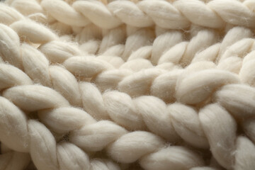 Fototapeta na wymiar White knitted wool texture as background, closeup