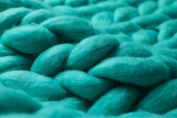 Turquoise knitted wool texture as background, closeup