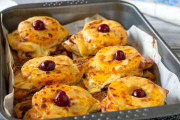 Open faced baked toast with chicken breast, cheese and pineapple in a baking pan