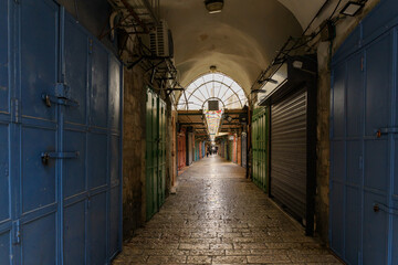 Closed shops on Daniel Street Arab market on a rainy day near the Yafo Gate in the old city of Jerusalem, in Israel