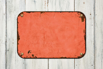 Vintage red tin sign on a wooden background