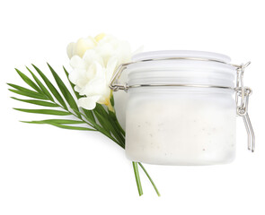 Jar of exfoliating salt scrub, palm leaf and freesia flowers on white background, top view