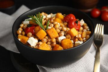 Delicious fresh chickpea salad on black table