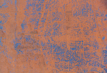 Brown rusty sheet of iron close-up, many cracks, damages and abrasions, ideal for background