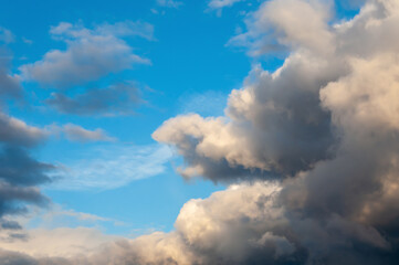 Obraz premium Dramatic storm clouds background with sunlight. Road to nowhere and air background concept. Forces of nature, dramatic sky before bad weather.