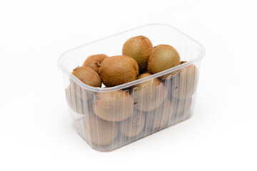kiwi fruit in a plastic basket on a white background
