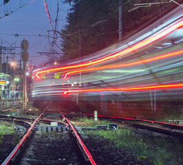 Fototapeta na wymiar Passenger train moves fast at evening time.