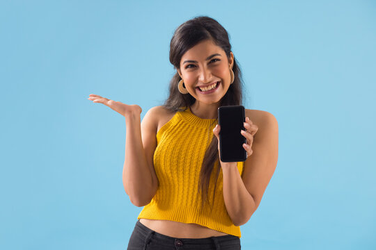 A Young Woman Showing Her Mobile Phone.	