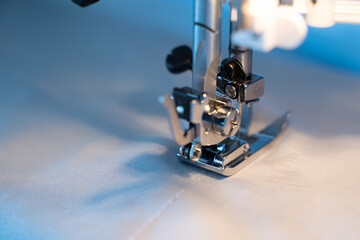 Close-up of a modern sewing machine that sews clothes