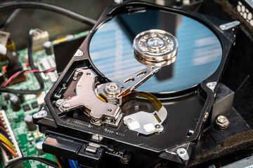 Close up of hard disk hard disk magnetic tape inside, open cover hard disk in computer or server. Technology background.