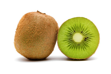two kiwi fruit, one whole and one cut on a white background