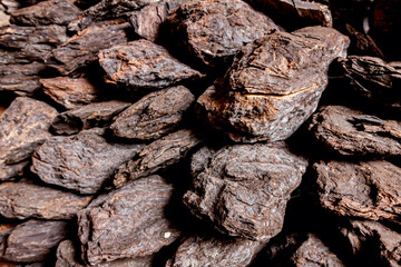 Dry charcoal pile stacked in basement