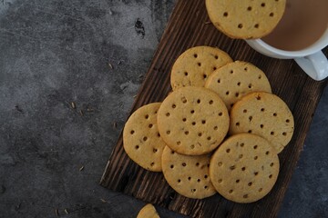 Homemade Indian Atta biscuits - Whole wheat cookies served with tea, selective focus