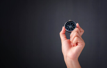 Business navigate concept, Businessman holding compass navigation for guide to recovery business planning growth in the economic crisis. © The KonG