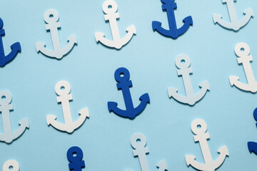 Blue anchors on a blue background.