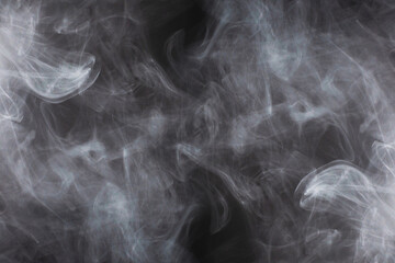 White steam on a black background.