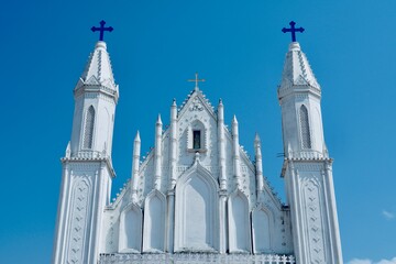 Morning star Church of our Lady of Good Health in Velankanni, Tamilnadu, India. Cathedral of Mary church tower against blue sky background.