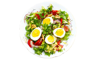 salad with lettuce, eggs,onions,nuts and tomatoes