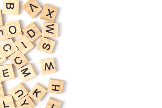 Top view the distribution of letters on wooden tiles scraped in a square shape Isolated on white background. with copy space
