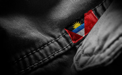 Tag on dark clothing in the form of the flag of the Antigua and Barbuda