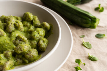 Homemade gnocchi with zucchini cream, typical Italian food