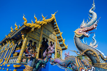 Fototapeta na wymiar Beautiful of blue temple Wat Rong Sua Ten the amazing temple.