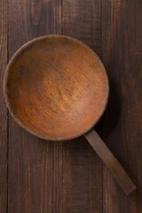 A LARGE WOODEN SPOON KEPT ON A TABLE 