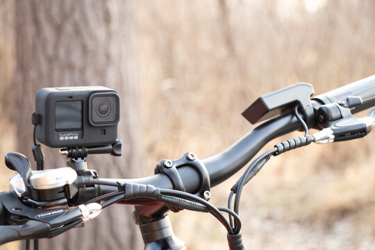 Ukraine Dnipro 30.03.2021 - Xiaomi HIMO C26 electric bike with camera pro 9 on the handlebars in the forest in spring, eco