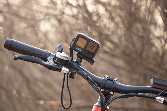 Ukraine Dnipro 30.03.2021 - Xiaomi HIMO C26 electric bike with camera pro 9 on the handlebars in the forest in spring, eco