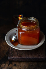 jar with homemade jam on a dark background