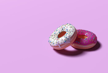 Two donuts with sprinkles, one white icing and one pink icing stacked on top of each other on a pink background with copy space and room for text with a right side composition