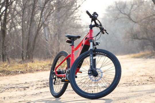 Ukraine Dnipro 30.03.2021 - Xiaomi HIMO C26 electric bike with camera pro 9 on the handlebars in the forest in spring, eco