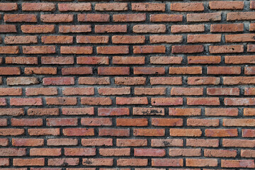 Vintage brown brick wall. Vertical view.