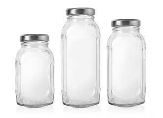 four glass jars isolated on white