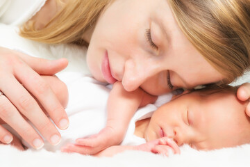 Obraz na płótnie Canvas Cheek to cheek with her baby