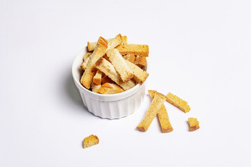 Homemade croutons in bowl isolated on white background