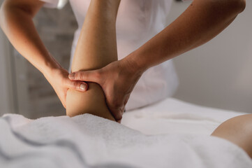 Close-up of feet, woman having leg rehabilitation massage