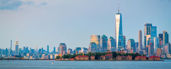 Fotobehang New York New York, New York, USA skyline from the harbor with Ellis Island  © SeanPavonePhoto