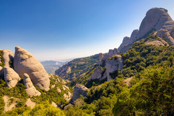 View of the Gorra Frigia peak and the ridges of the Lluerners mountain range. Montserrat Massif...