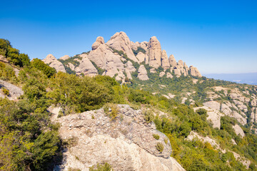 Fototapeta na wymiar View from the viewpoint of the Sierra Paparres of different peaks that make up the Natural Park of the Montserrat massif, Catalonia, Spain