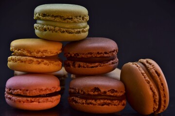 macarons multicolored on a black background 