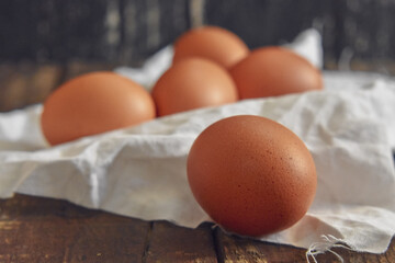 Fresh Eggs on Wooden table Background