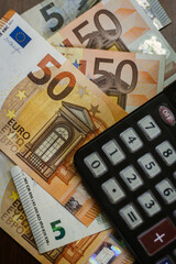50 Euro bills with a calculator