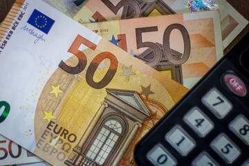 50 Euro bills with a calculator