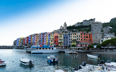 Porto Venere, Liguria, Italy. June 2020. Enchanting urban landscape of the colorful houses of the old town overlooking the harbor. Beautiful summer day.