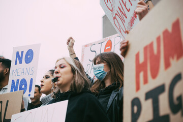 Female activist participating in anti-racism protest during COVID-19