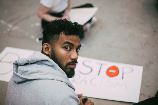 Portrait of male activist making signboard