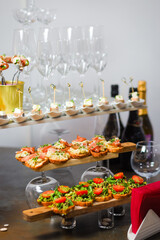 Catering service. Table with snacks food at event.