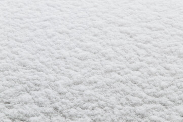 winter background: fresh clean even snow, large snowflakes