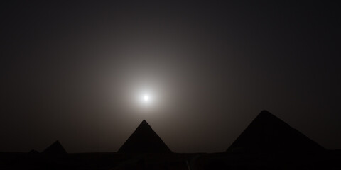 View of the three ancient Egyptian pyramids of Giza, the Pyramids of Menkaure, Khafre,  and Giza...